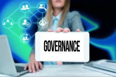 Text caption presenting Governance. Word Written on exercised in handling an economic situation in a nation Business Woman Sitting In Office Holding Mobile Displaying Futuristic Ideas. clipart