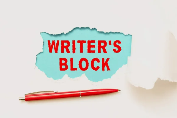 Conceptual display Writer S Block. Concept meaning Condition of being unable to think of what to write Tear on sheet reveals background with pen on board — 图库照片