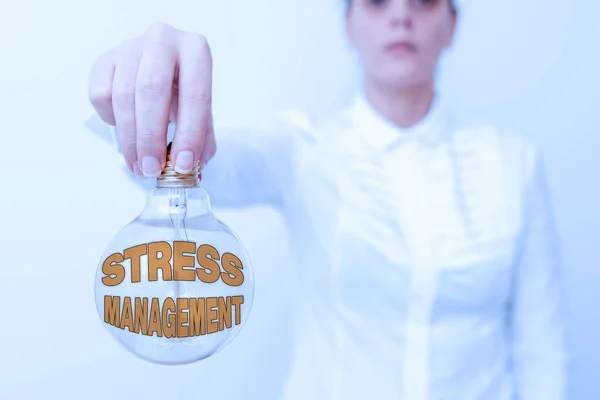 Sign displaying Stress Management. Business idea method of limiting stress and its effects by learning ways Lady in outfit holding lamp upside down presenting new technology ideas
