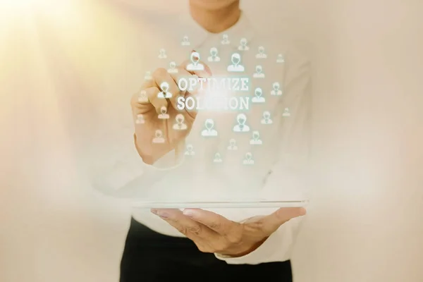 Text sign showing Optimize Solution. Business idea process of finding the greatest value of the solution Lady In Uniform Standing Holding Tablet Typing Futuristic Technologies.