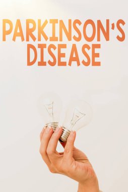 Parkinson S hastalığını gösteren bir mesaj. Hareketi etkileyen iş konsepti sinir sistemi bozukluğu. Yeni teknoloji fikirlerini gösteren ya da sunan iki el feneri tutuyor.