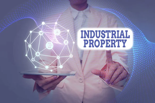 Conceptual display Industrial Property. Business approach the intangible ownership of a trademark or patent Lady In Uniform Holding Tablet In Hand Virtually Tapping Futuristic Tech. — Stockfoto