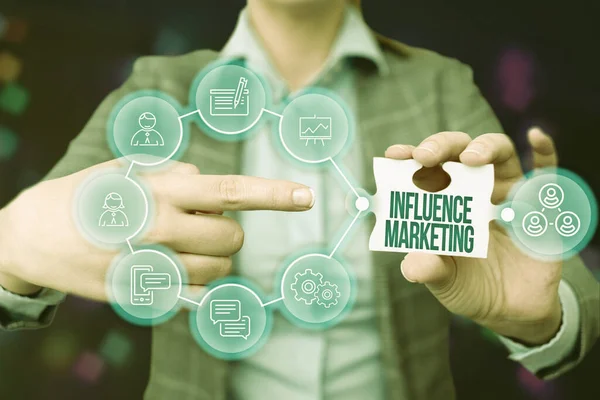 Inspiration showing sign Influence Marketing. Business overview Using key leaders to drive a brand s is message to market Business Woman Pointing Jigsaw Puzzle Piece Unlocking New Futuristic Tech.