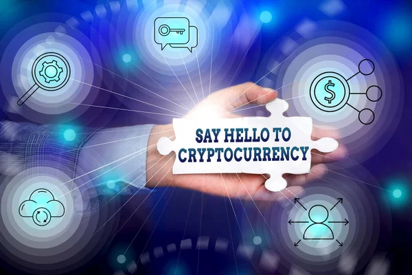 Writing displaying text Say Hello To Cryptocurrency. Business overview Lead and advertise decentralized money exchange Hand Holding Jigsaw Puzzle Piece Unlocking New Futuristic Technologies.