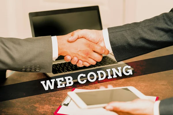 Writing displaying text Web Coding. Conceptual photo a system of symbols and rules used to represent instructions Two Professional Well-Dressed Corporate Businessmen Handshake Indoors