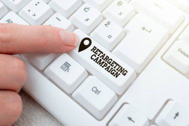 Conceptual caption Retargeting Campaign. Business concept targetconsumers based on their previous Internet action Lady finger showing-pressing keyboard keys-buttons for update clipart
