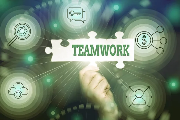 Conceptual caption Teamwork. Word for the group s is collaborative effort to accomplish a common goal Hand Holding Jigsaw Puzzle Piece Unlocking New Futuristic Technologies. — Stock Photo, Image