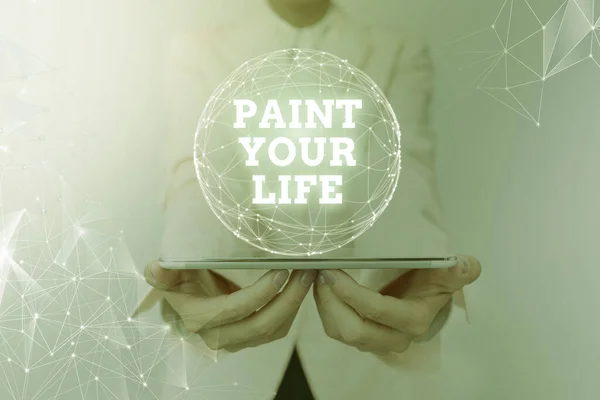 Conceptual display Paint Your Life. Business approach Taking control and create your future to achieve goals Woman In Suit Holding Tablet With Circular Holographic Display. — Stockfoto