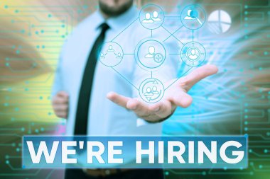 El yazısı işareti. Yeniden işe alıyoruz. Başvuruların incelenmesi ve adayların bulunması üzerine yazılan sözcük Gentelman Uniform Yeni Gelecek Teknolojileri Bekliyor.