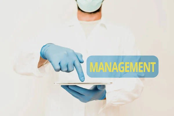 Text caption presenting Management. Conceptual photo the authoritative act of directing or controlling things Doctor Explaining Medical Terms, Scientist Teaching Laboratory Safety — Fotografia de Stock