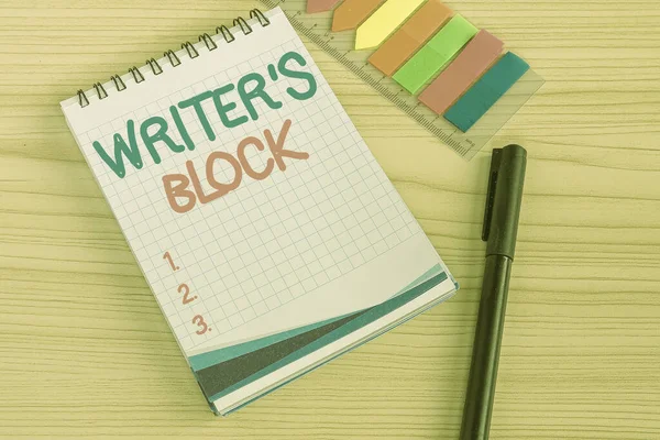Sign displaying Writer S Block. Word Written on Condition of being unable to think of what to write Multiple Assorted Collection Office Stationery Photo Placed Over Table