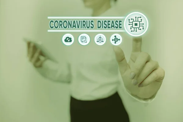 Hand writing sign Coronavirus Disease. Word Written on defined as illness caused by a novel virus SARSCoV2 Lady Holding Tablet Pressing On Virtual Button Showing Futuristic Tech. — Zdjęcie stockowe