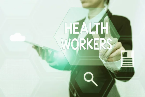 Inspiration showing sign Health Workers. Internet Concept showing whose job to protect the health of their communities Woman In Suit Holding Tablet Showing Futuristic Interface Display. — 图库照片