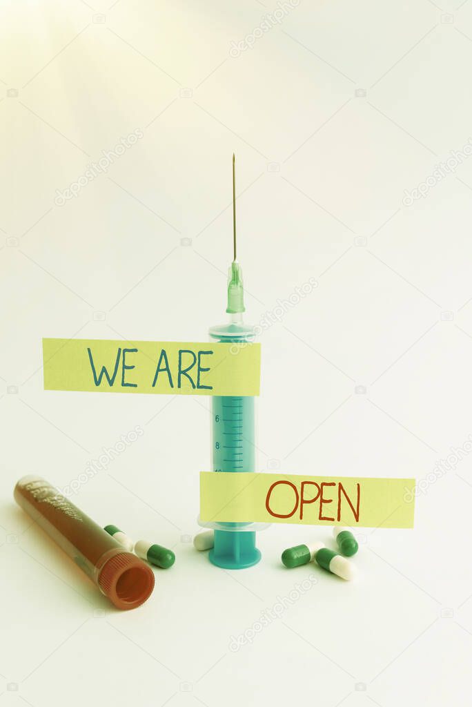 Text caption presenting We Are Open. Business approach no enclosing or confining barrier, accessible on all sides Writing Important Medical Notes Laboratory Testing Of New Infections