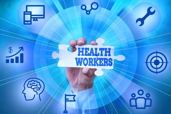Handwriting text Health Workers. Internet Concept showing whose job to protect the health of their communities Hand Holding Jigsaw Puzzle Piece Unlocking New Futuristic Technologies. — Stockfoto