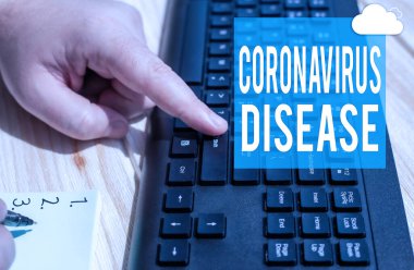 İlham verici Coronavirus Hastalığı 'nı gösteren metin. İş fikri, yeni bir virüs olan SARSCoV2 'nin Not Defterinde Kalemle Yazarken Klavye Tuşlarına Basması sonucu ortaya çıkan hastalık olarak tanımlandı.