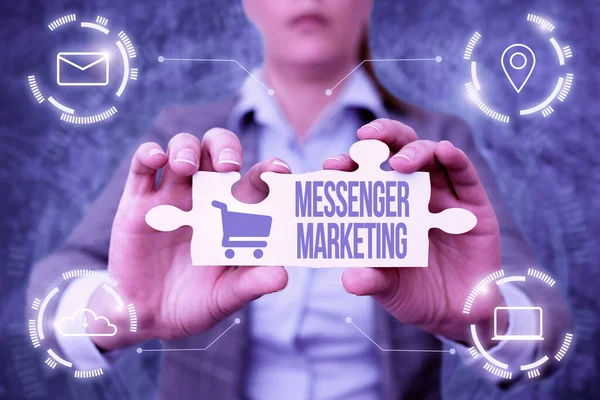 Tekst weergeven Messenger Marketing. Business overview act of marketing to your customers using a messaging app Business Woman Holding Jigsaw Puzzle Piece Unlocking New Futuristic Tech. — Stockfoto