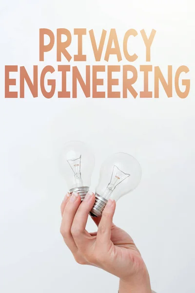 Εννοιολογική επίδειξη Privacy Engineering. Word for engineered systems provide acceptable levels of privacy Δύο φωτιστικά που δείχνουν ή παρουσιάζουν νέες τεχνολογικές ιδέες — Φωτογραφία Αρχείου