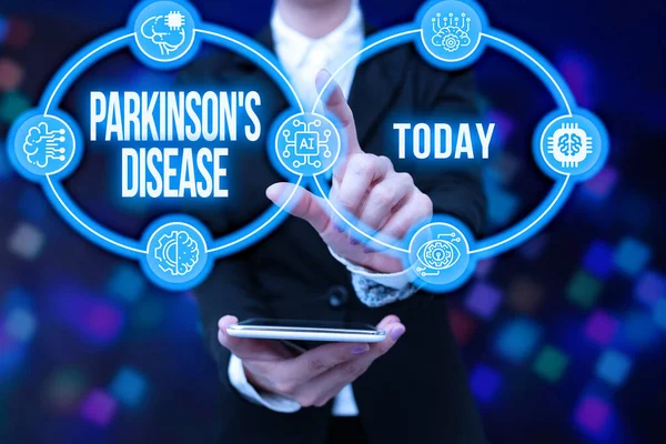 Textová značka ukazující Parkinsonovu nemoc. Koncept znamená nervový systém porucha, která ovlivňuje pohyb Lady v uniformě držení tablet v ruce Prakticky klepání futuristické technologie. — Stock fotografie