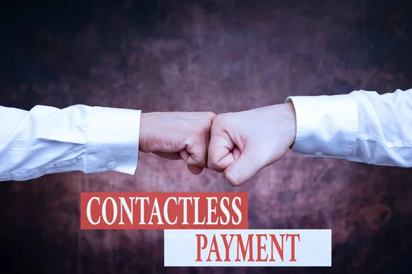 Sign displaying Contactless Payment. Conceptual photo use near field communication for making secure payments Two Professional Well-Dressed Corporate Businessmen Handshake Indoors