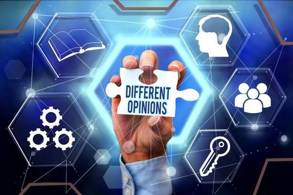 Sign displaying Different Opinions. Business overview a conflict of opposed ideas or attitudes or goals Hand Holding Jigsaw Puzzle Piece Unlocking New Futuristic Technologies. — 图库照片