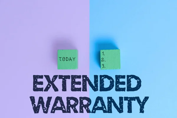 Text caption presenting Extended Warranty. Conceptual photo contract which gives a prolonged warranty to consumers Two Objects Arranged Facing Inward Outward On a Separated Coloured Background — Stock Fotó