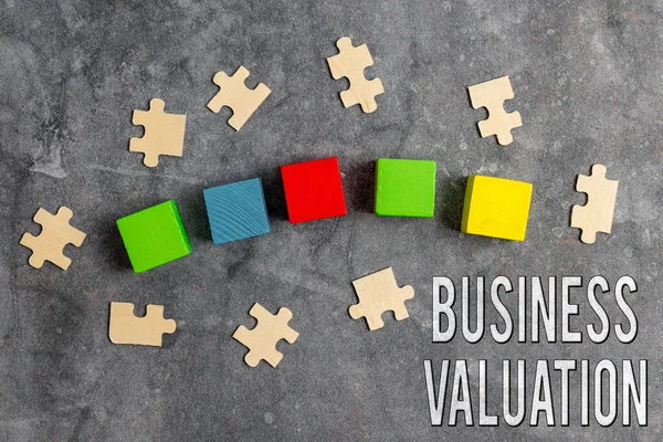 Conceptual display Business Valuation. Business overview determining the economic value of a whole business Stack of Sample Cube Rectangular Boxes On Surface Polished With Multi-Colour — Stockfoto