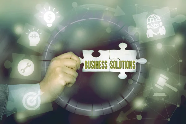 Text caption presenting Business Solutions. Business overview ideas used to help a company achieve its objectives Hand Holding Jigsaw Puzzle Piece Unlocking New Futuristic Technologies. — Zdjęcie stockowe