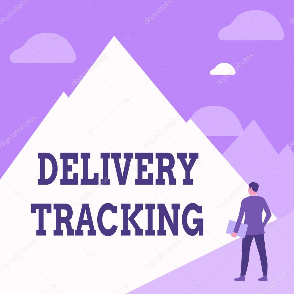 Hand writing sign Delivery Tracking. Conceptual photo the process of localizing shipping containers and mails Gentleman In Suit Standing Holding Notebook Facing Tall Mountain Range.