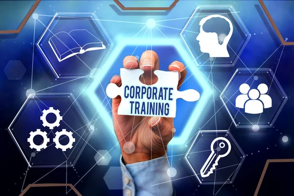 Text sign showing Corporate Training. Business showcase improving the employees performance morale and skills Hand Holding Jigsaw Puzzle Piece Unlocking New Futuristic Technologies.