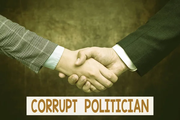 Text sign showing Corrupt Politician. Business showcase a public leader who misuse of public authority and fund Two Professional Well-Dressed Corporate Businessmen Handshake Indoors — ストック写真