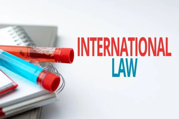 Text showing inspiration International Law. Business approach system of treaties and agreements between nations Writing Important Medical Notes Laboratory Testing Of New Virus Medicine