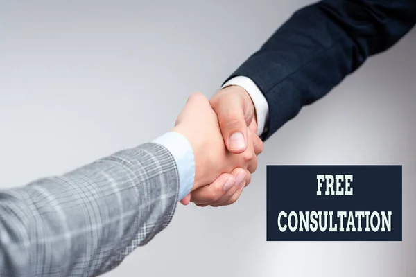 Conceptual display Free Consultation. Business overview meeting to discuss something or to get advice without fee Two Professional Well-Dressed Corporate Businessmen Handshake Indoors — Stockfoto