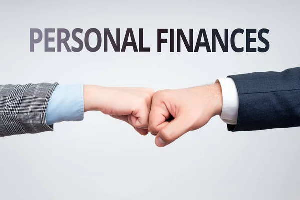 Conceptual caption Personal Finances. Internet Concept the activity of managing own money and financial decisions Two Professional Well-Dressed Corporate Businessmen Handshake Indoors — 图库照片