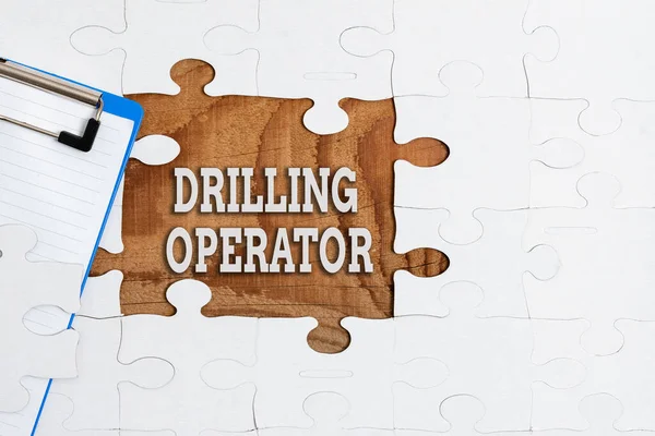 Text showing inspiration Drilling Operator. Conceptual photo someone that do the rigging and drilling operations Building An Unfinished White Jigsaw Pattern Puzzle With Missing Last Piece — ストック写真