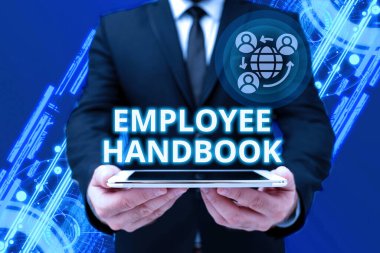 Text caption presenting Employee Handbook. Internet Concept states the rules and regulations and policies of a company Man In Office Uniform Holding Tablet Displaying New Modern Technology.