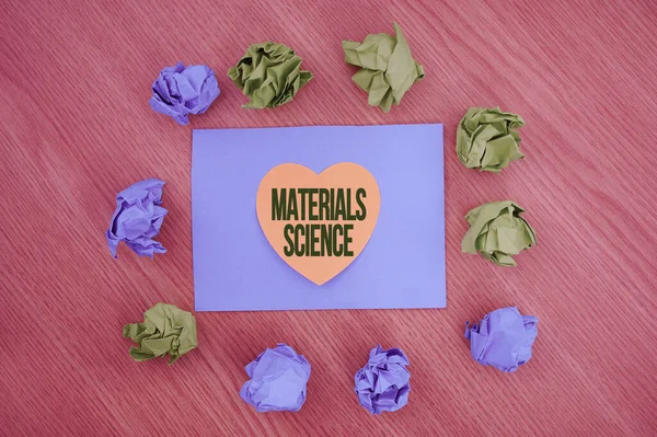 Conceptual caption Materials Science. Internet Concept interdisciplinary field involving the properties of matter Colorful Crumpled Papers Circular Pattern Surrounding Heart Shaped Card. — Foto Stock