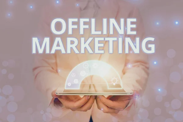 Inspiration showing sign Offline Marketing. Word for Advertising strategy published outside of the internet Lady In Uniform Holding Pen Phone Showing Futuristic Virtual Interface. — Zdjęcie stockowe