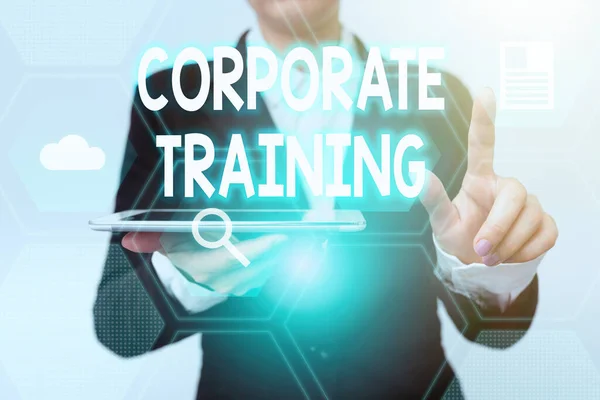 Inspiration showing sign Corporate Training. Concept meaning improving the employees performance morale and skills Woman In Suit Holding Tablet Pointing Finger On Futuristic Virtual Button. — Photo