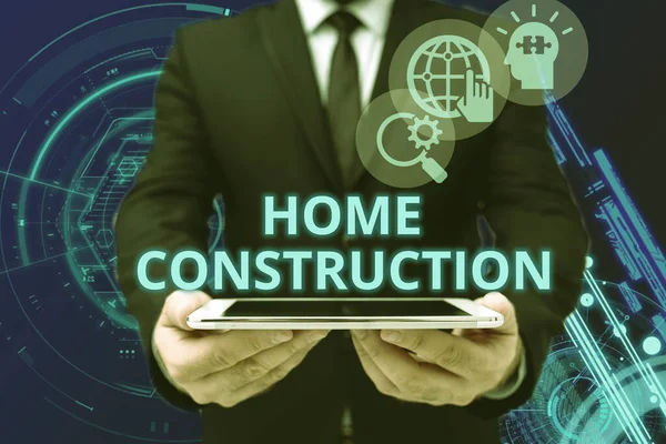 Text sign showing Home Construction. Business overview the process of constructing a living accommodation Man In Office Uniform Holding Tablet Displaying New Modern Technology. — Foto Stock