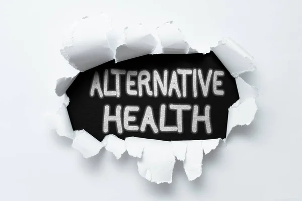 Text caption presenting Alternative Health. Business concept products and practices that are not part of standard care Tear on sheet reveals background behind the front side