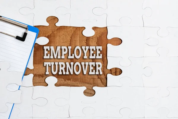 Conceptual display Employee Turnover. Word for the percentage of workers who leave an organization Building An Unfinished White Jigsaw Pattern Puzzle With Missing Last Piece —  Fotos de Stock