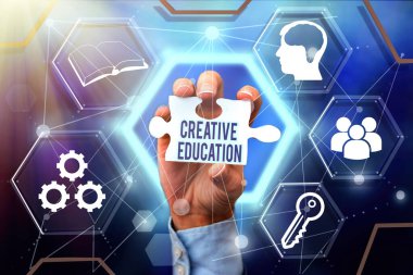 Conceptual display Creative Education. Business concept students able to use imagination and critical thinking Hand Holding Jigsaw Puzzle Piece Unlocking New Futuristic Technologies.