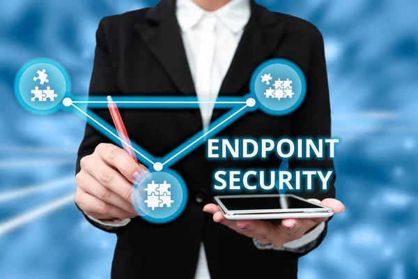 Hand writing sign Endpoint Security. Word for the methodology of protecting the corporate network Lady In Uniform Holding Tablet In Hand Virtually Typing Futuristic Tech. — Stockfoto