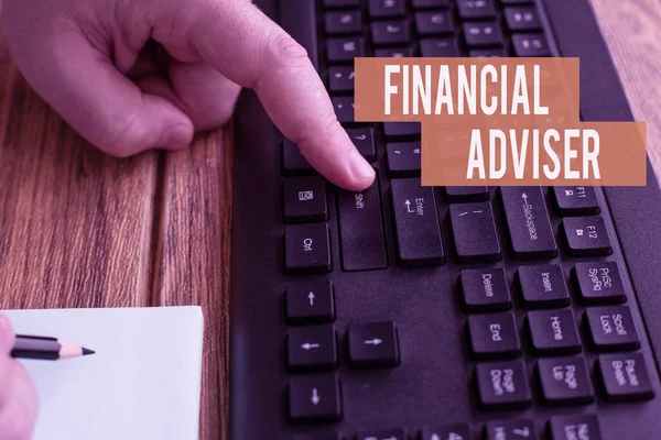 Handwriting text Financial Adviser. Word for person who is employed to provide financial services Hands Pressing Computer Keyboard Keys While Writing With Pencil In Notepad. — Foto Stock