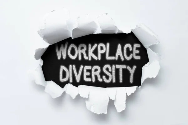 Text showing inspiration Workplace Diversity. Business overview environment that accepts each individual s is differences Tear on sheet reveals background behind the front side — Stock Photo, Image