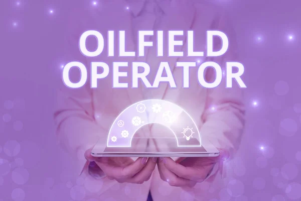 Handwriting text Oilfield Operator. Business showcase responsible for optimizing production of the oil wells Lady In Uniform Holding Pen Phone Showing Futuristic Virtual Interface. — Stok fotoğraf