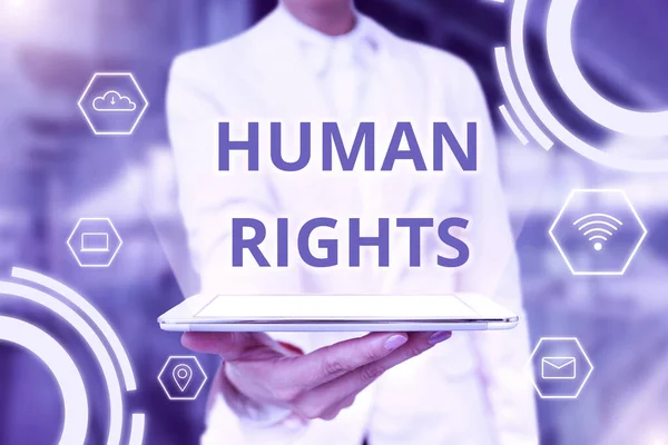 Inspiration showing sign Human Rights. Concept meaning the equality of fighting for your rights individuality Lady Uniform Standing Tablet Hand Presenting Virtual Modern Technology — Fotografia de Stock