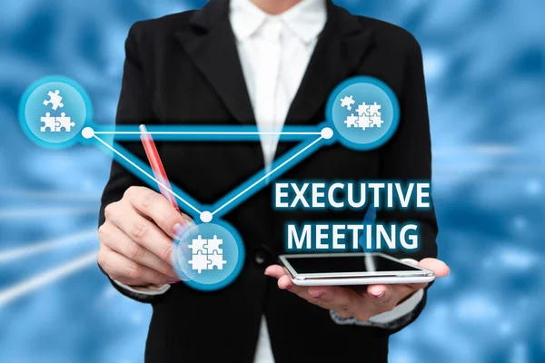 Text sign showing Executive Meeting. Business concept discuss a specific topic with boards and general members Lady In Uniform Holding Tablet In Hand Virtually Typing Futuristic Tech. — Photo