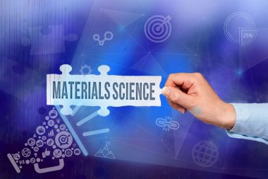 Text showing inspiration Materials Science. Business idea interdisciplinary field involving the properties of matter Hand Holding Jigsaw Puzzle Piece Unlocking New Futuristic Technologies.